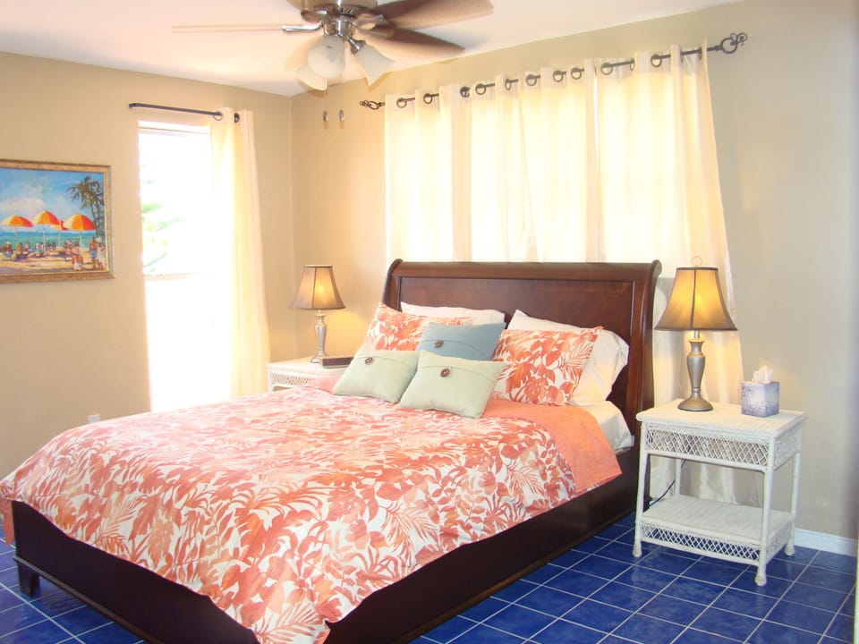 Master bedroom overlooks front patio 