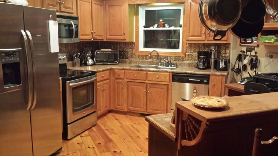 Gourmet kitchen is fully stocked with every utensil and gadget needed! 