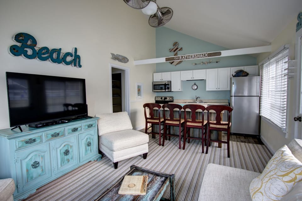 Open concept living room kitchen and bar seating