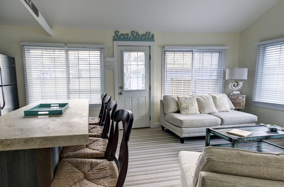 Living room, entrance and bar seating