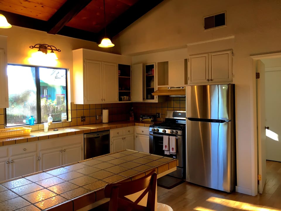 Fully stocked and upgraded kitchen with new stainless steel gas stove, etc.