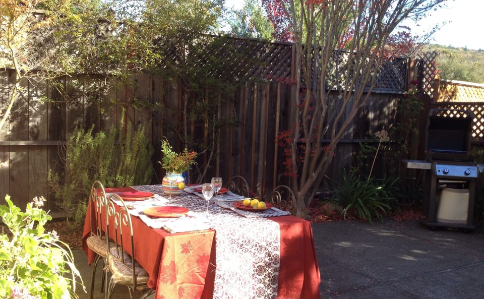 Yard table and BBQ grill.