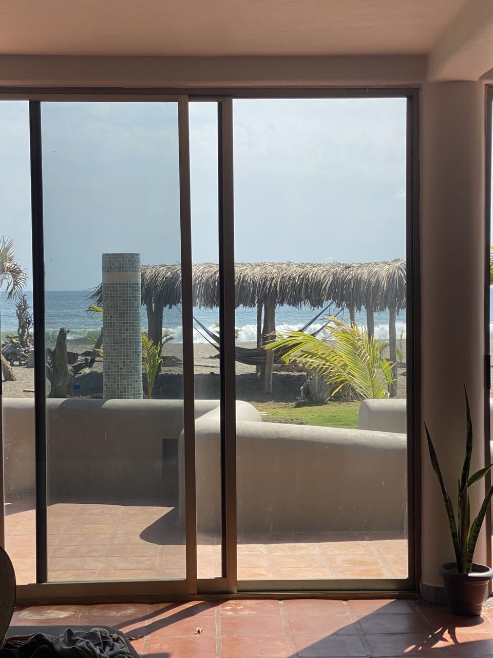 Palapa in the soft sand with the sound of the ocean.. swaying in a hammock..