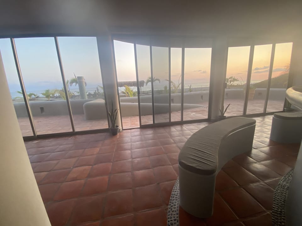 Views from well equipped kitchen looking over bartop.