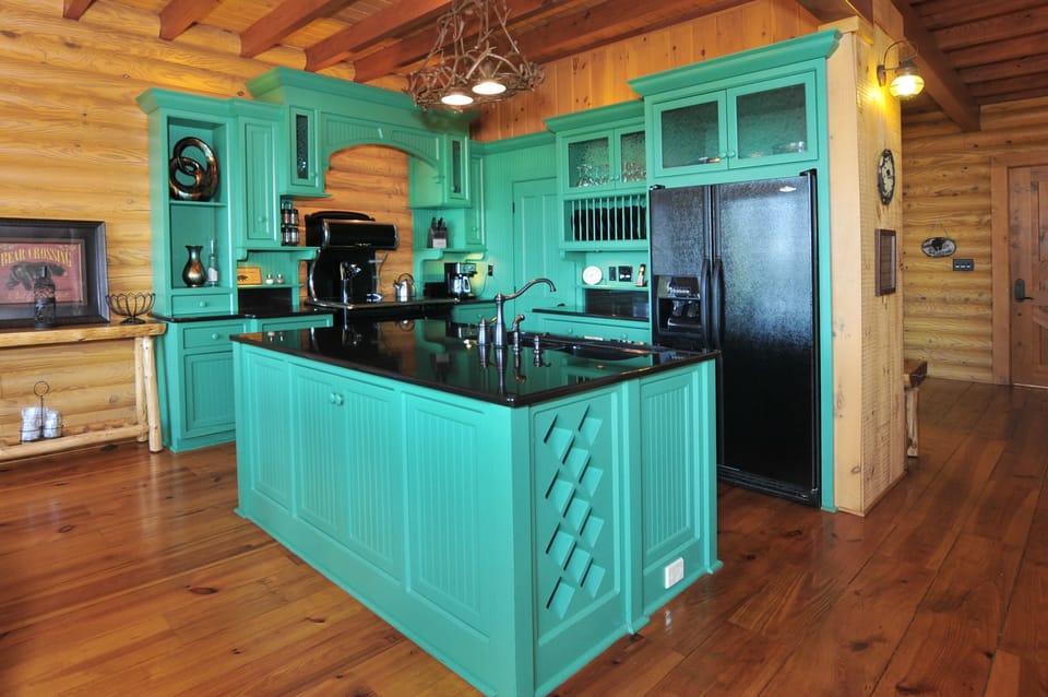 Beautiful modern kitchen with simulated Elmira stove, island, granite counters.