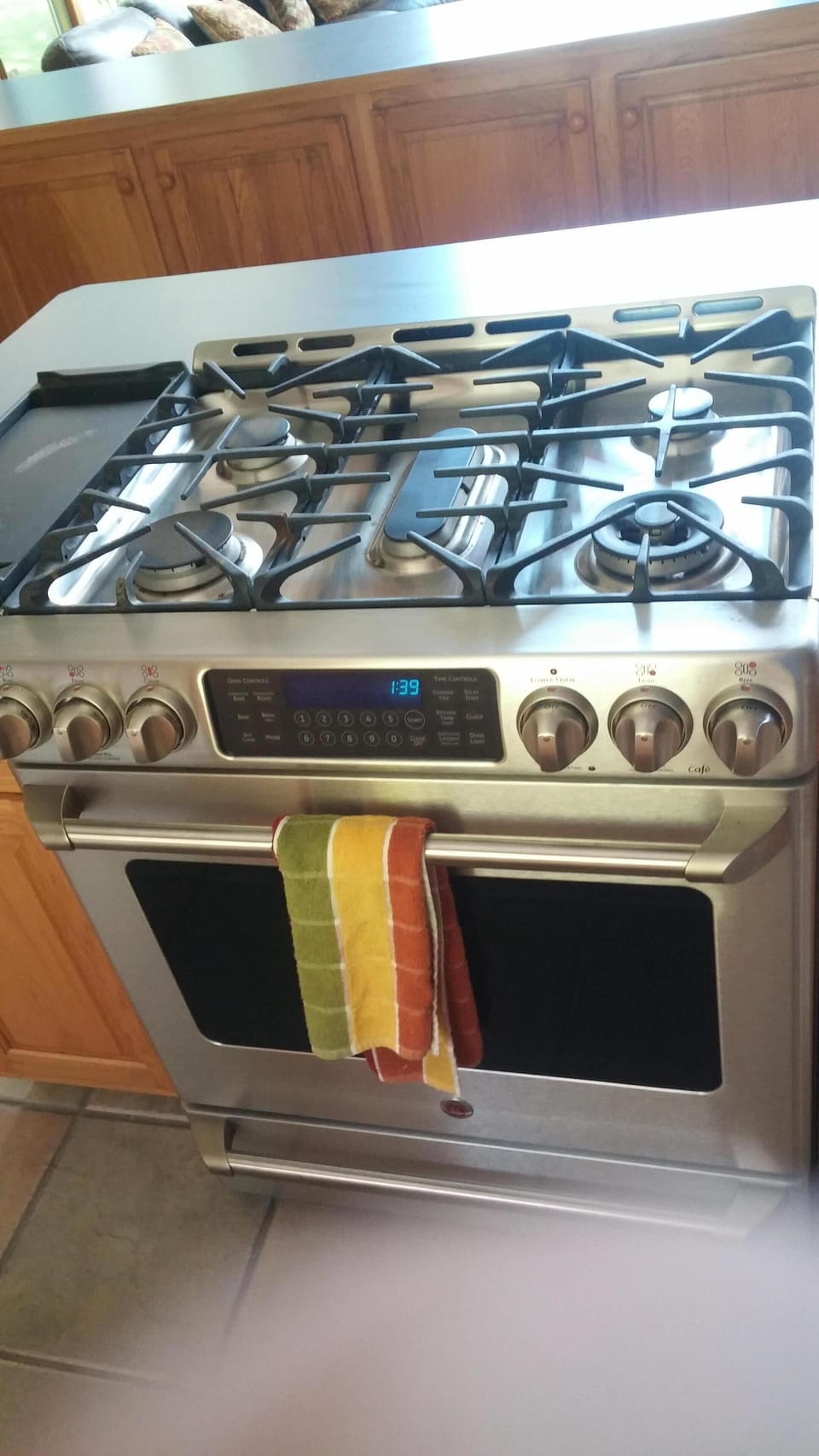 GE Profile gas range & oven with food warmer and center burner w/griddle