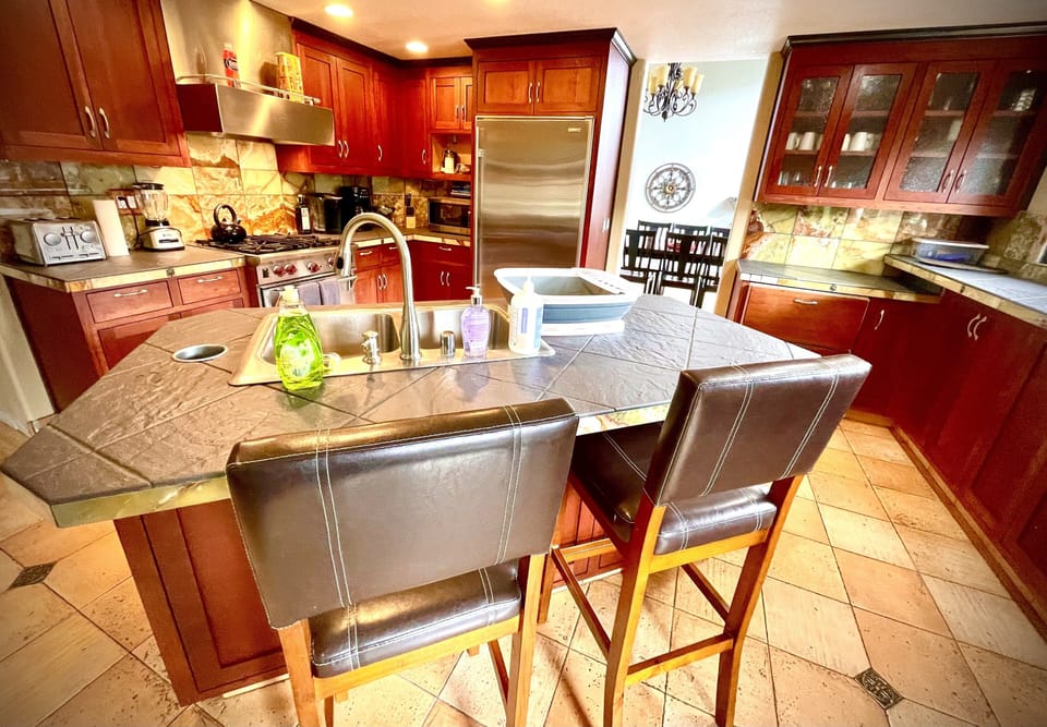 Modern chiefs kitchen. Large selection of pots, knives, pans & cooking utensils