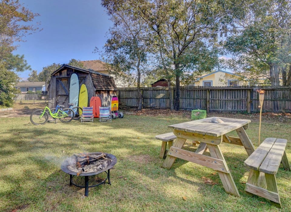 The "Sled Shack" with "CatchSurf" brand surfboards and beach amenities 