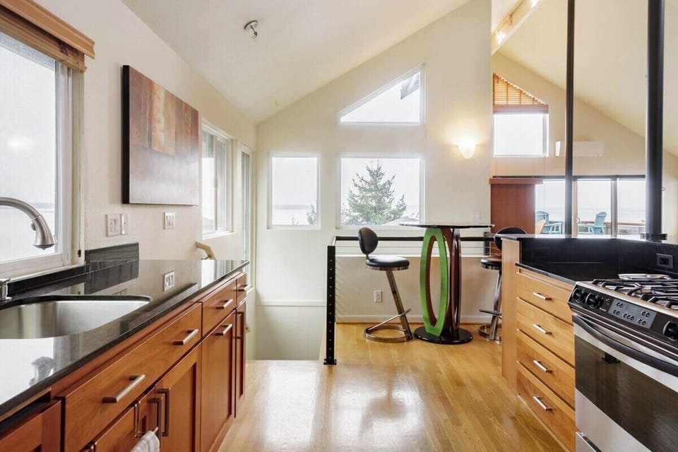 The cafe table at the end of the kitchen is a great place for morning coffee.