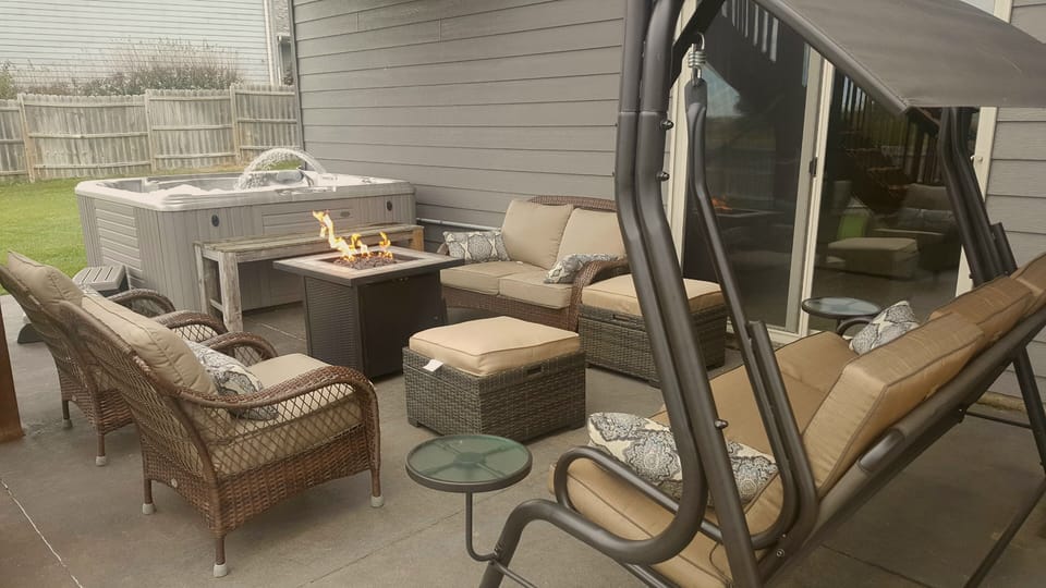 Fenced in yard with lots of space.  7 person hot tub with lots of furniture.