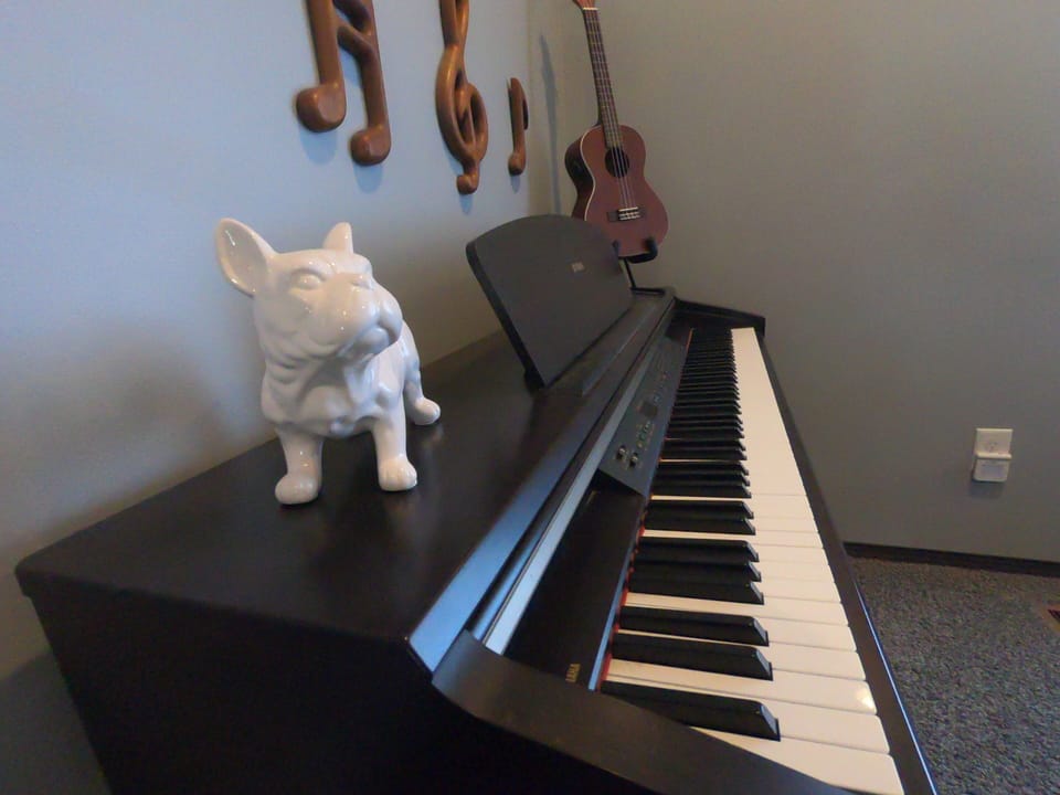 Play a song with this yamaha digital piano or the ukulele 