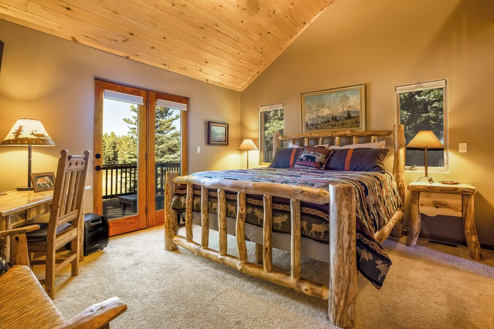 The Primary Bedroom has a king bed, a desk in case you need to work, and a smart TV