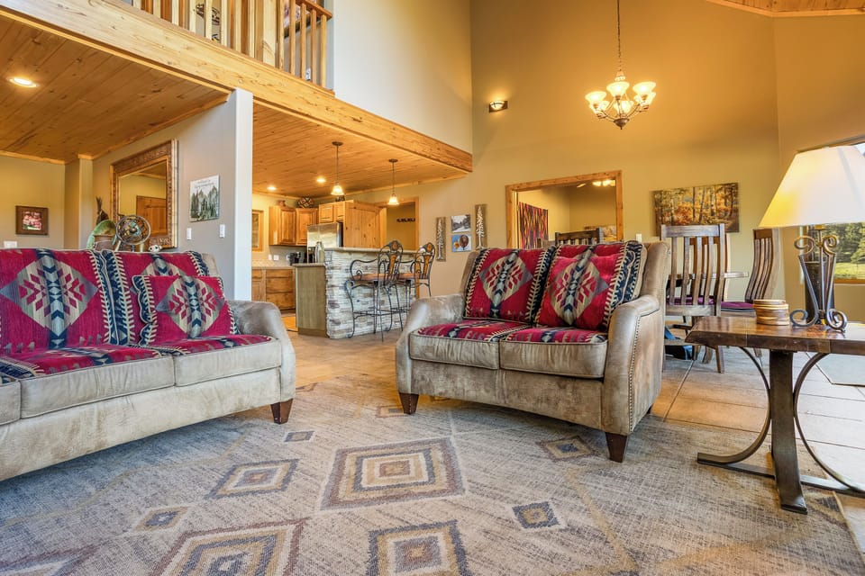 The main space features a beautiful open floor plan, uniting kitchen, living room, and breakfast nook