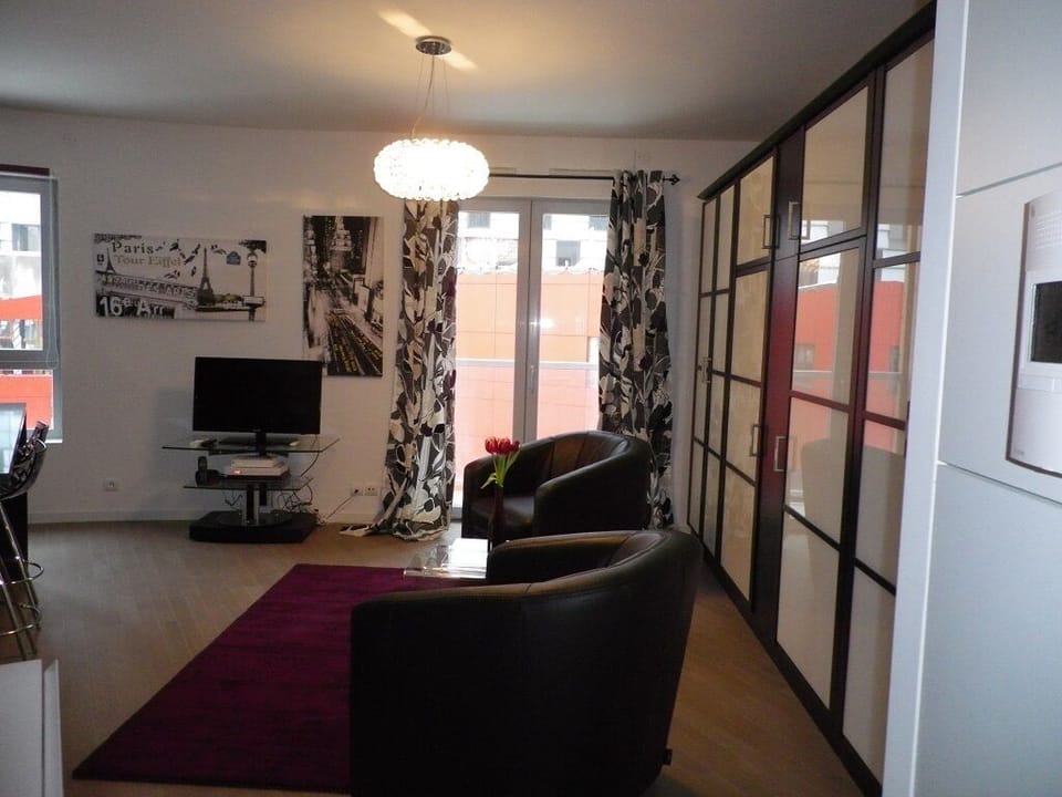 Entry View of Living Area & Large Doors and Window allowing for Natural Light