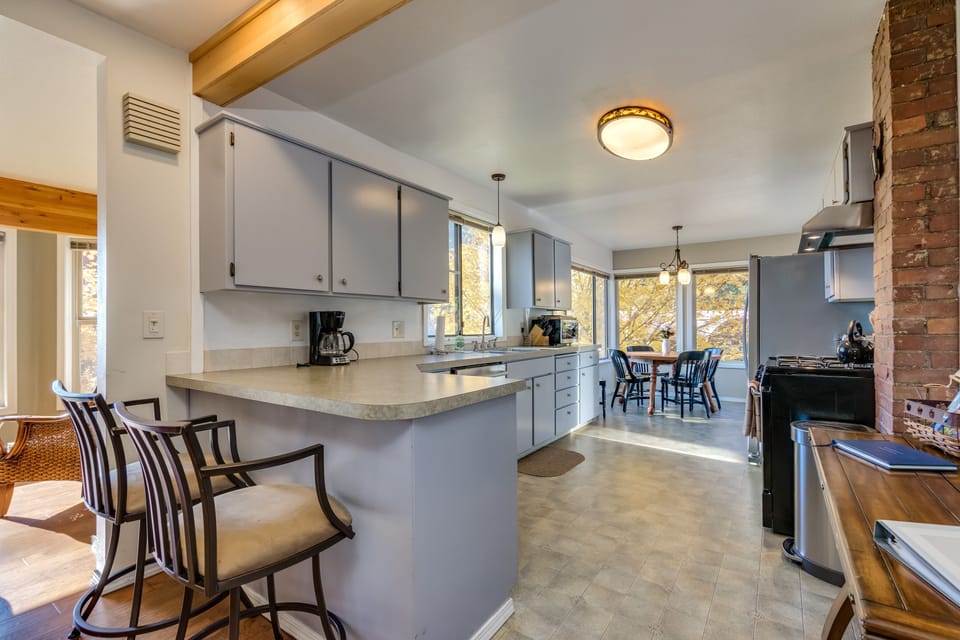 Kitchen with adjoining dining area all with views of the lake