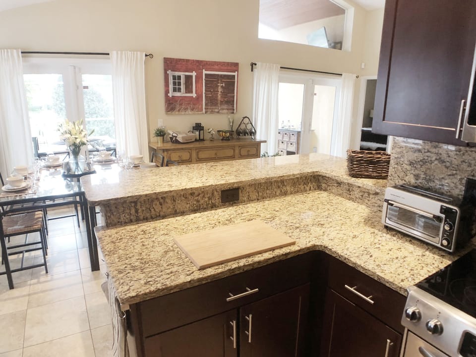 Kitchen with granite breakfast bar.