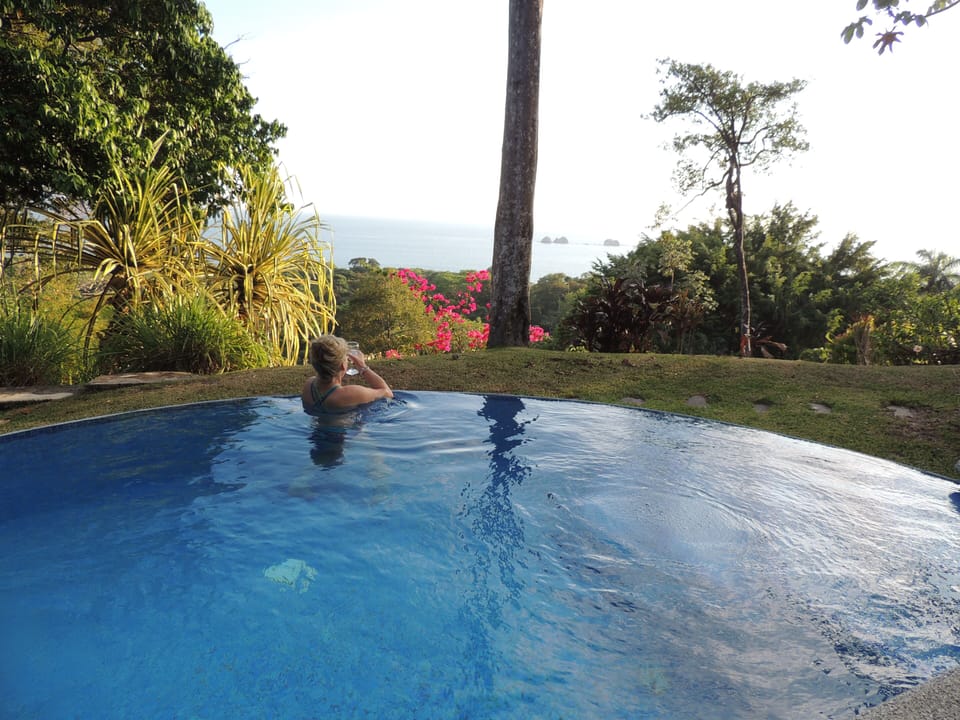 Relax in the infinity pool with your favorite beverage.
