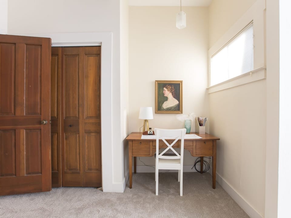 Private office space in a bedroom with privacy door, and en suite full bathroom 