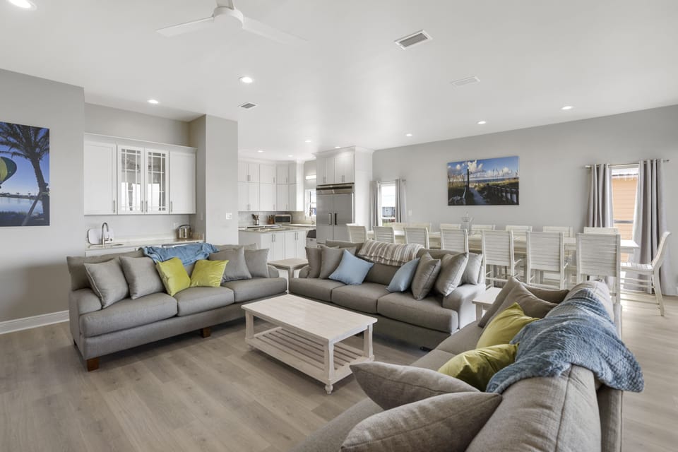Living room with plenty of space and wet bar with under counter wine cooler.