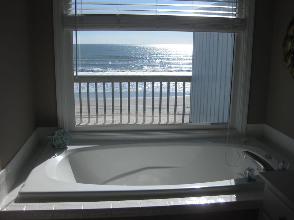 jacuzzi overlooking ocean in master bathroom