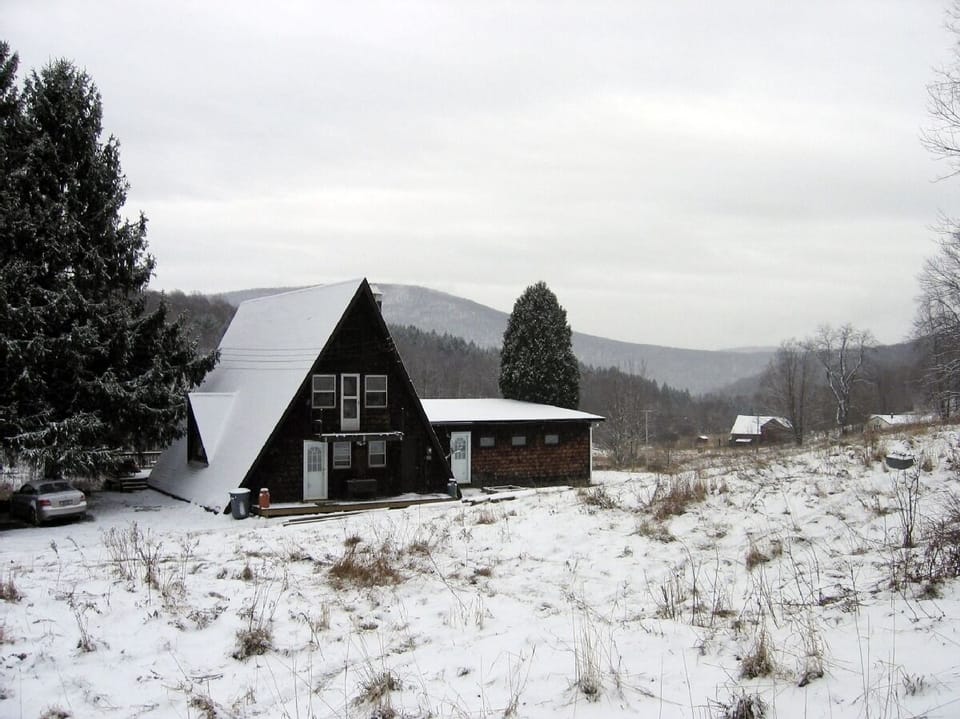 the house after a sprinkling of snow