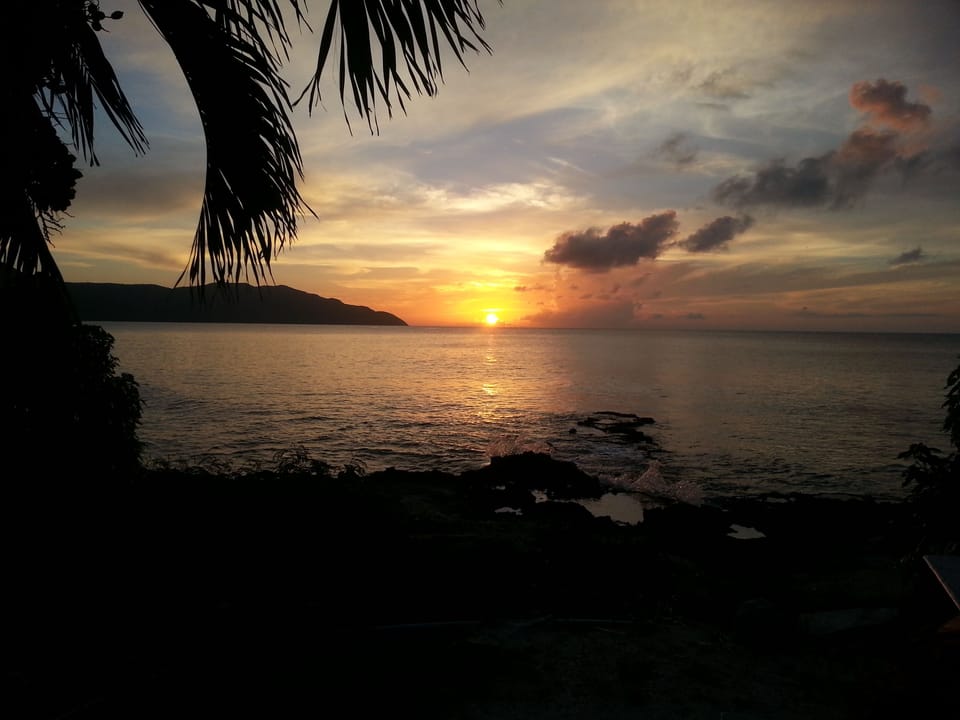 Sunset from Cain Bay ! An awesome spot for fun & food & world class diving !! 