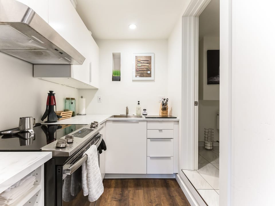 Plenty of pantry storage in a well-lit kitchen. 