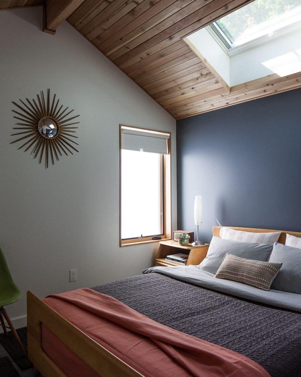 Queen bed with a skylight view to a 50 ft. Cedar tree