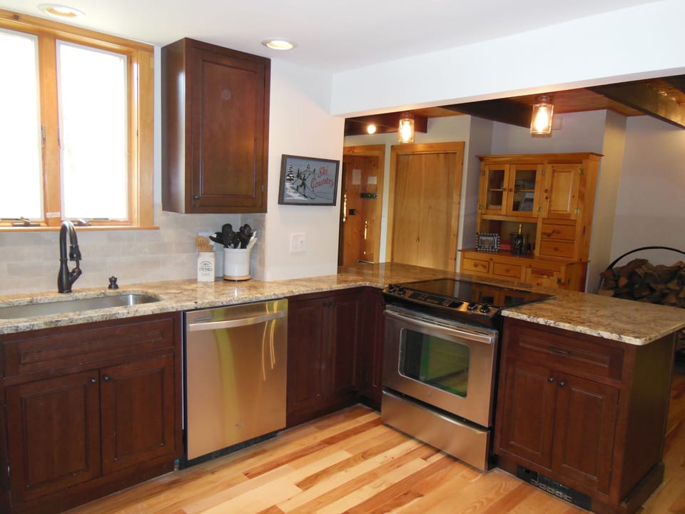 Kitchen remodeled with cherry cabinets & stainless steel appliances