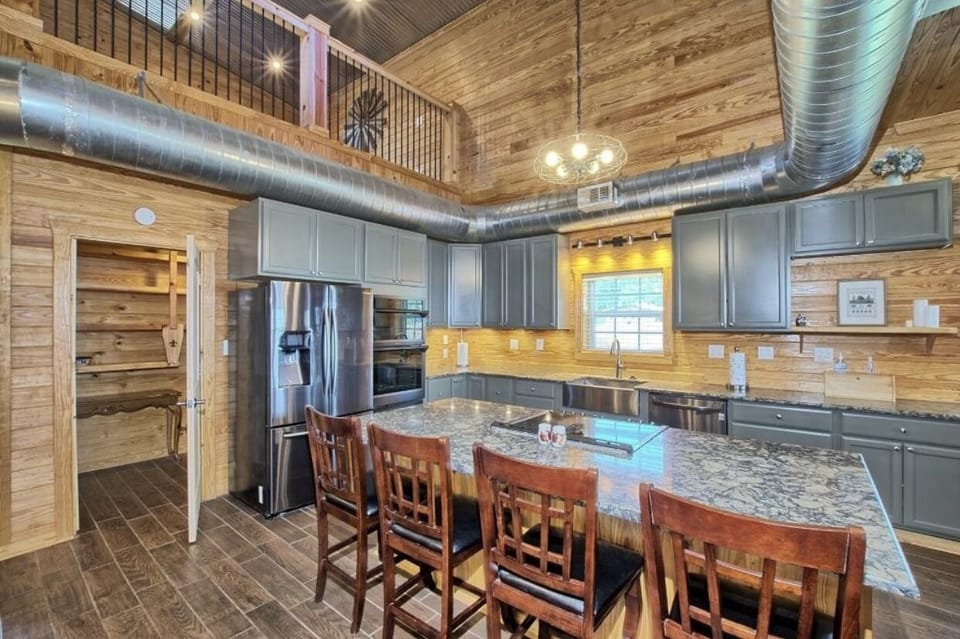 Double full size ovens, quartz counter tops, stainless appliances, huge pantry.
