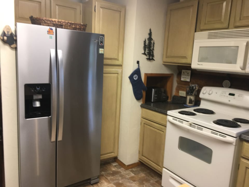Kitchen with Stainless Refrigerator, Stove and Microwave