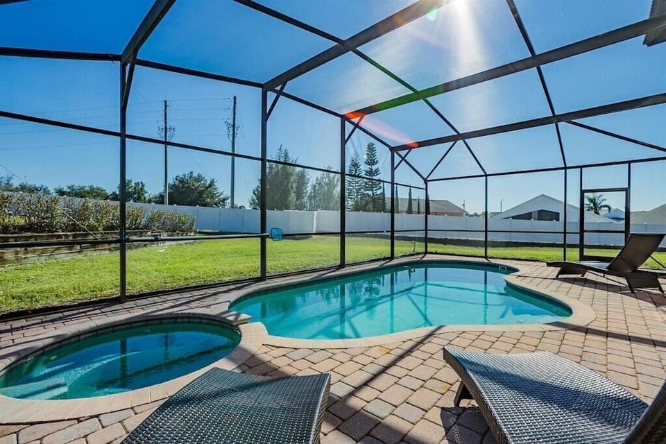 Relax by the screened-in pool and soak in the sunshine in your private outdoor oasis.