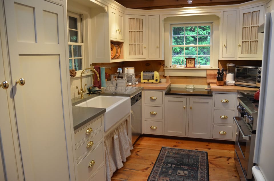 Fully-equipped kitchen includes farm sink, quiet Miele dishwasher, gas stove.
