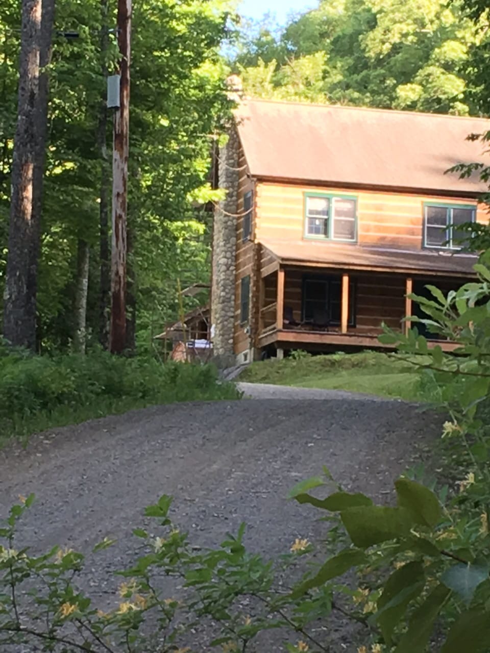 The quaint drive to meet the house in springtime. 
