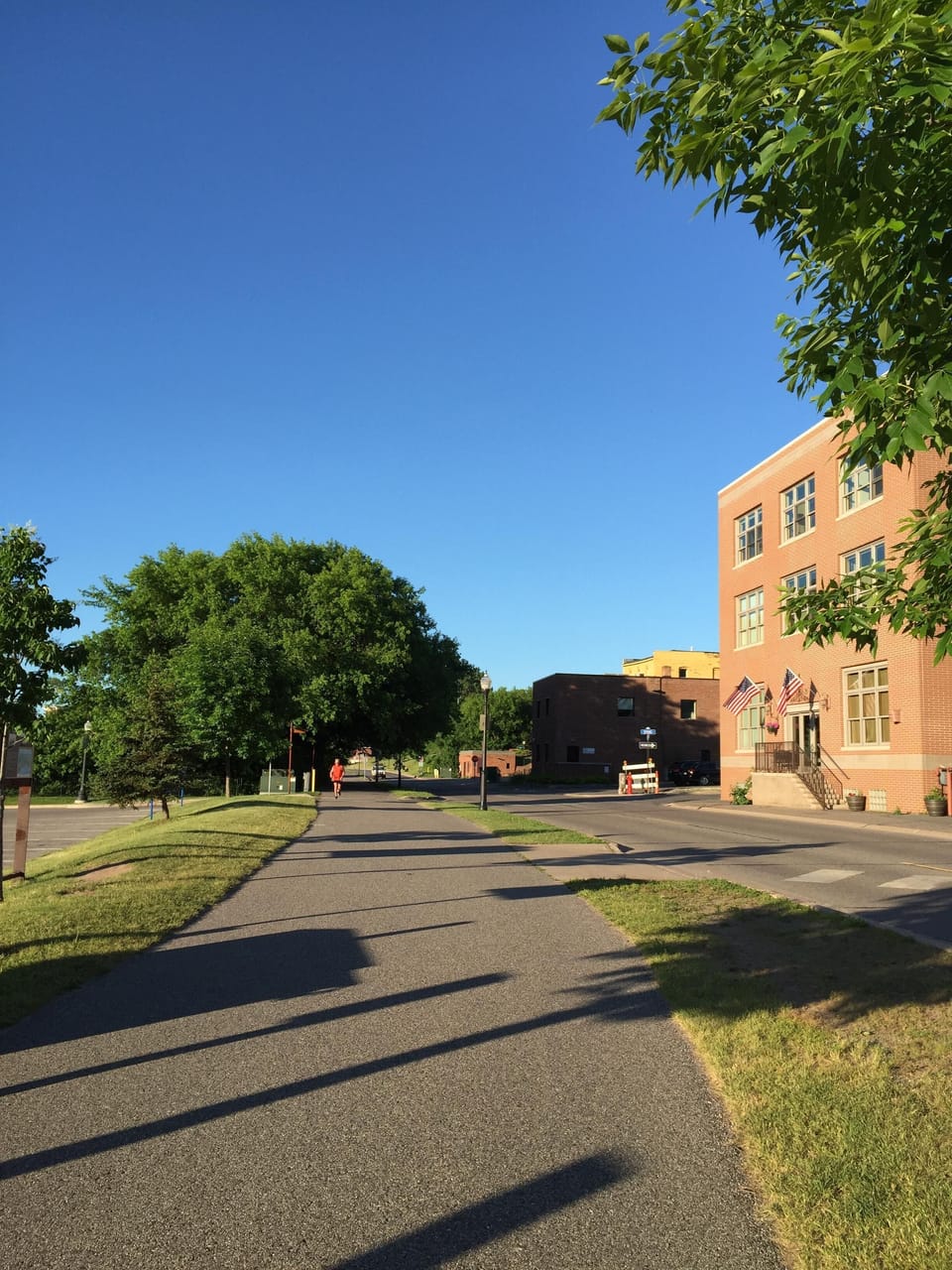 Building on right side of Lakeshore Blvd, directly across street from bike path.