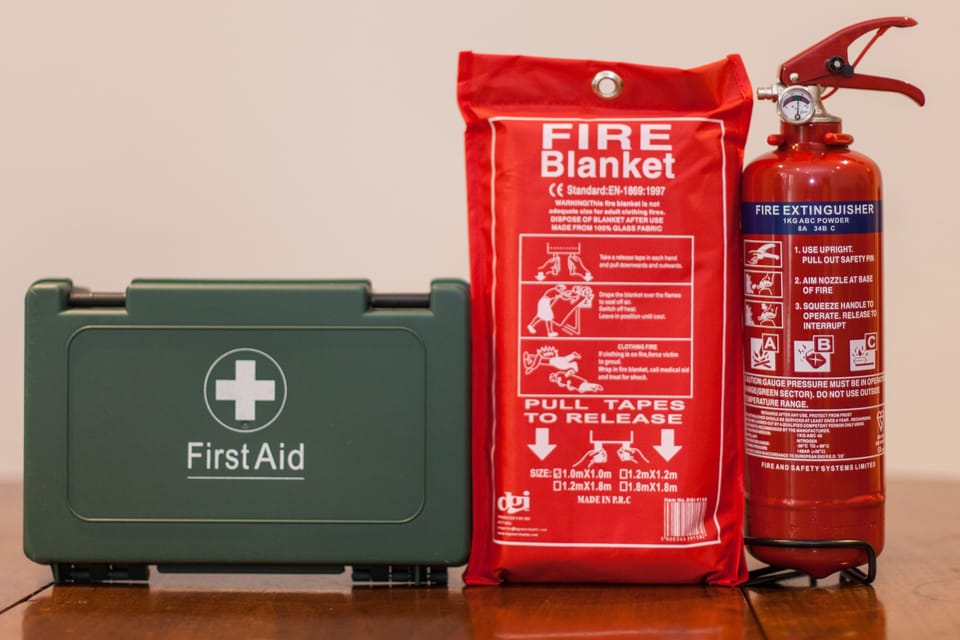 Fire extinguisher, fire blanket and first aid kit