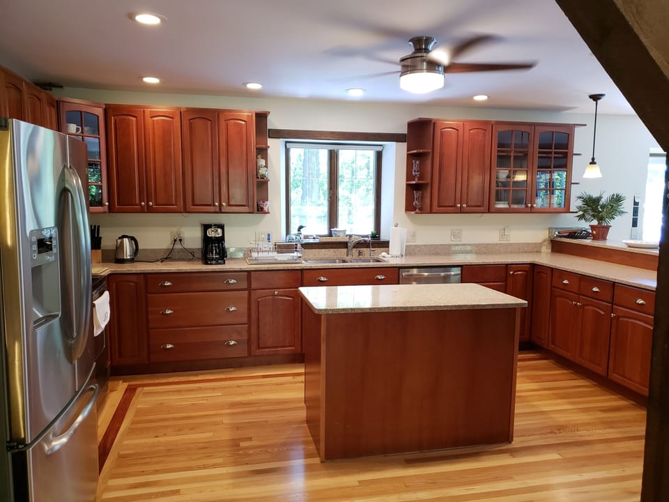 Newly renovated kitchen with stainless steel appliances and granite countertops.