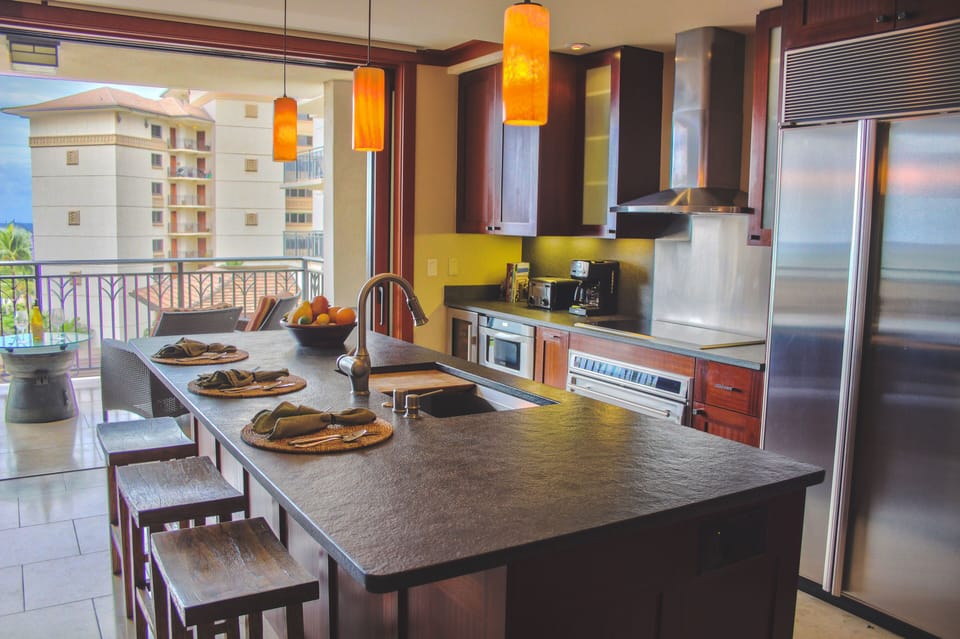 The kitchen and living room open to a lanai with ocean views.