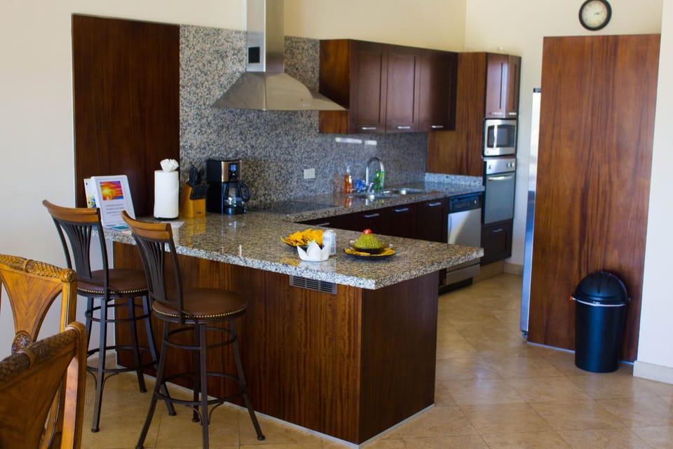Fully equipped kitchen with pots and pans. 