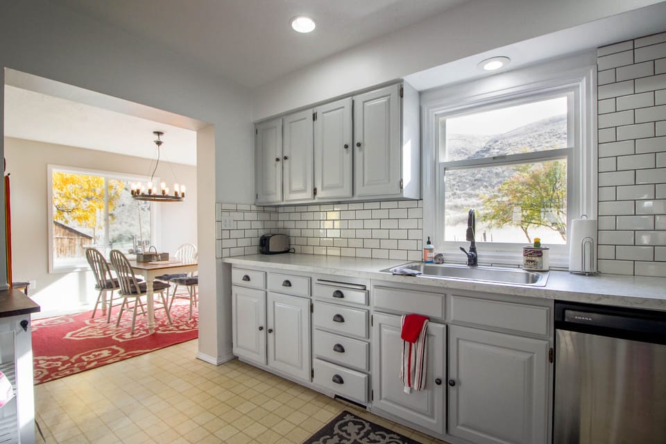 Kitchen and Dining with views.  Access directly to large deck with BBQ.