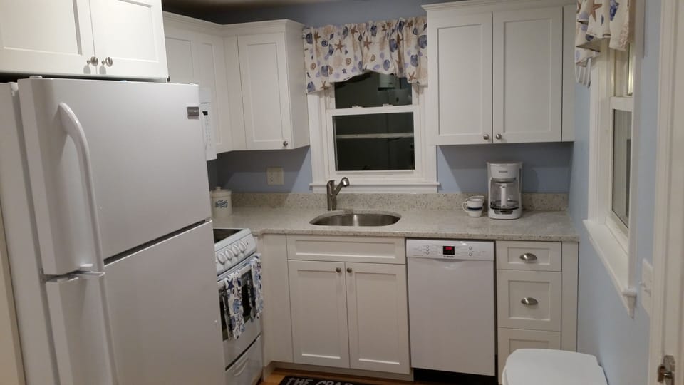 NEW KITCHEN. STOVE, DISHWASHER, COFFEE MAKER, UTENSILS, DISHES,  POTS AND PANS