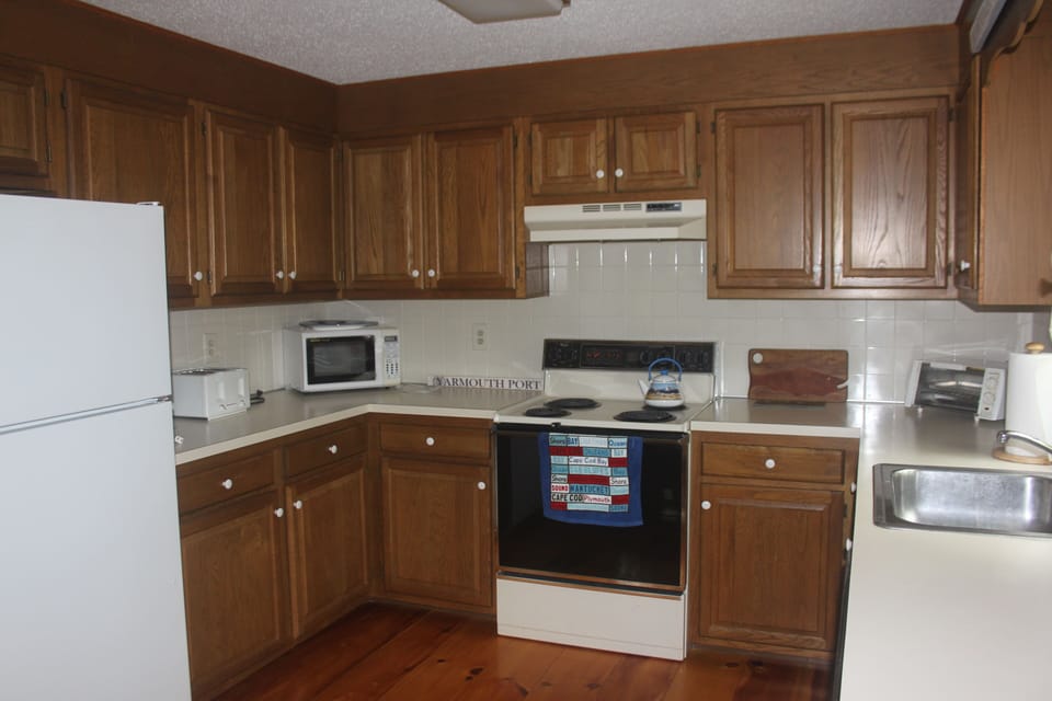 Kitchen with Electric Stove, Toaster, Toaster Oven, and Microwave