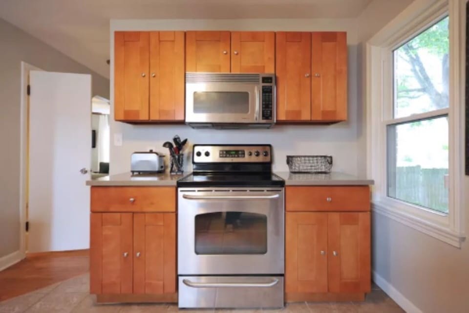 It includes a gas stove, microwave, fridge, coffee maker, etc.