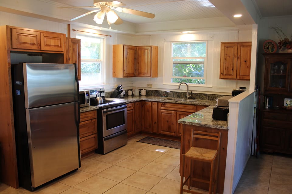 New kitchen with new appliances and gas stove.