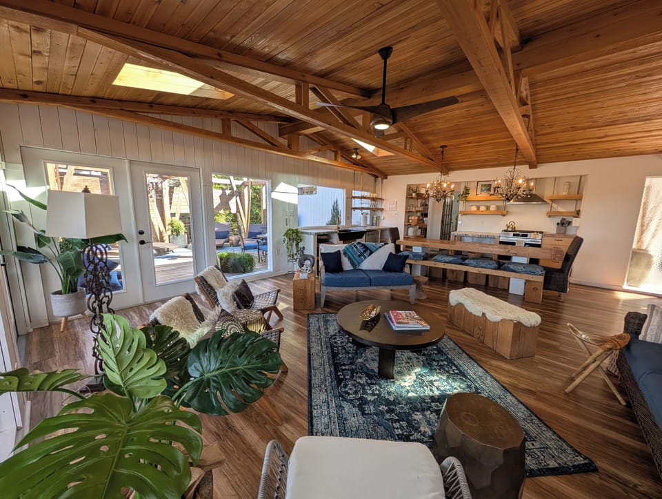 Tree line home built into the cliffside. With parking right at the front door.