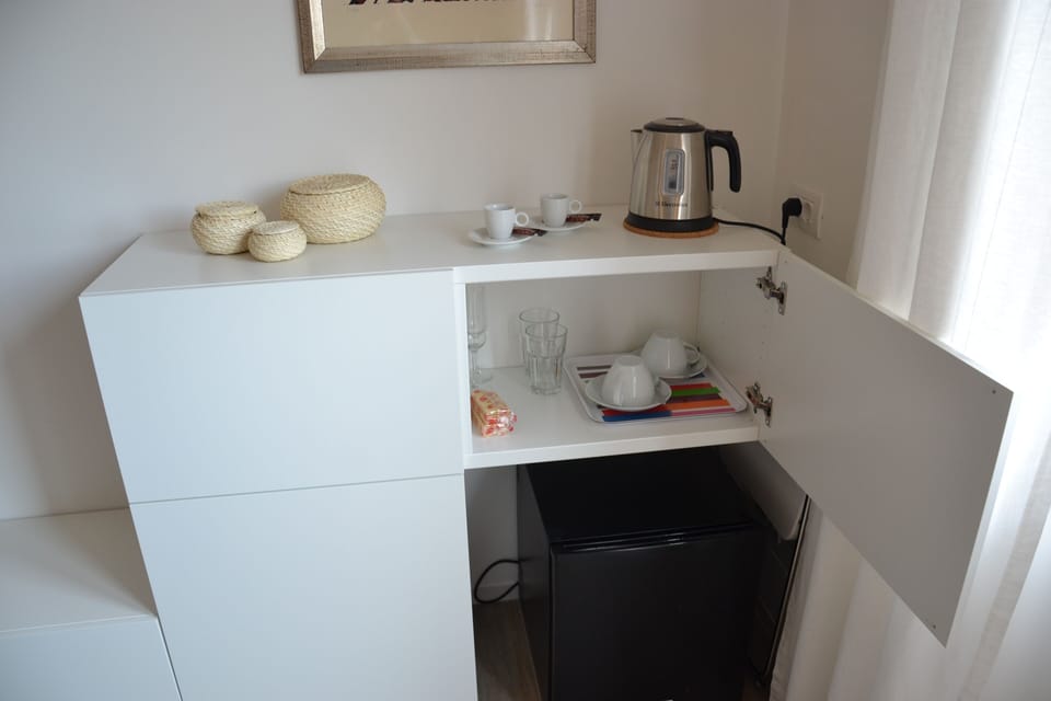 Mini fridge, electric kettle, cups, glasses, etc.