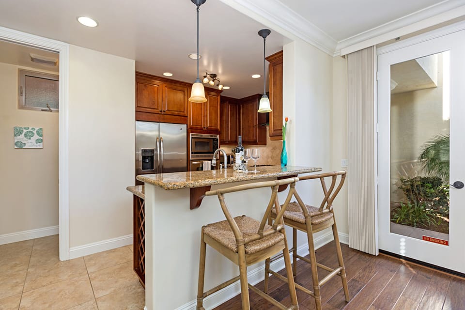 Gourmet kitchen is fully stocked. Bar seating for 2.