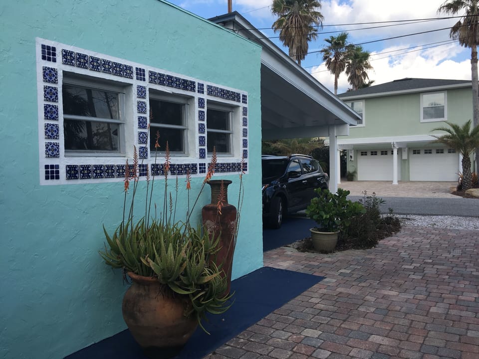 side of cottage showing kitchen windows.