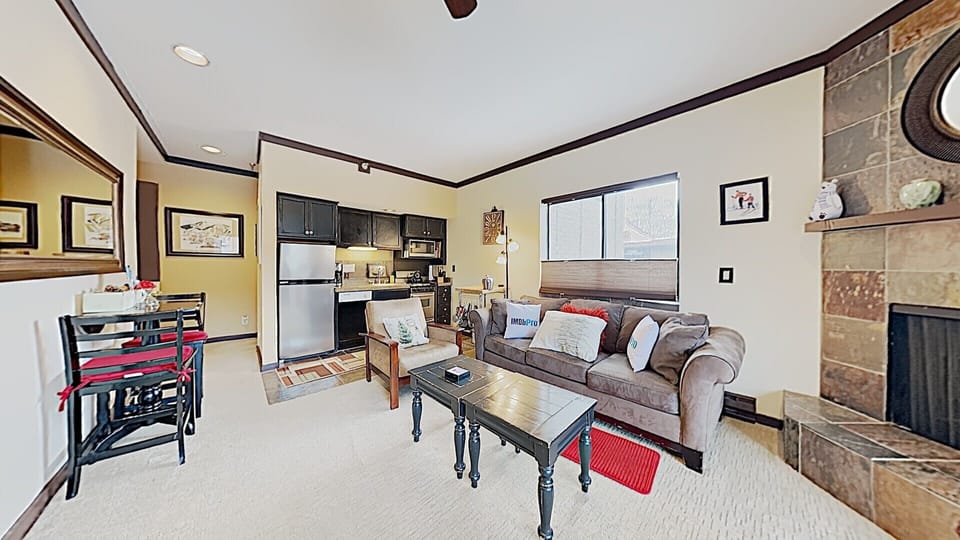 living room and kitchen.  gas fireplace  and dining area