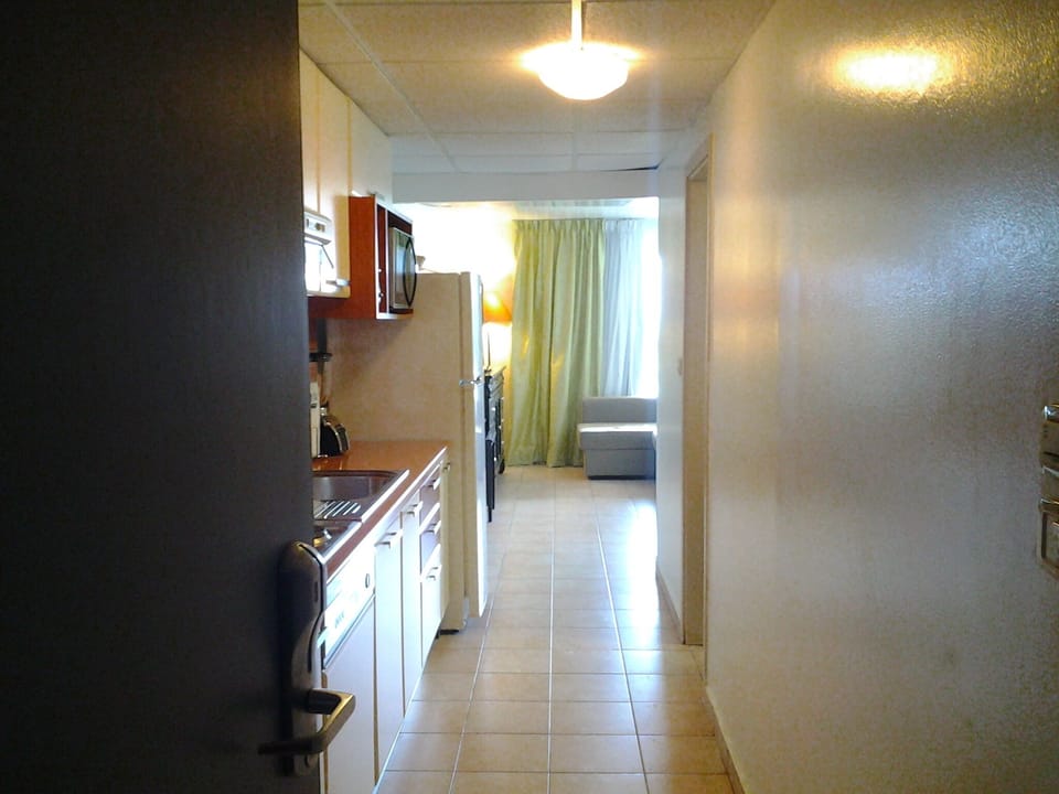 Entering the Studio Unit into the full kitchen with plenty appliances!
